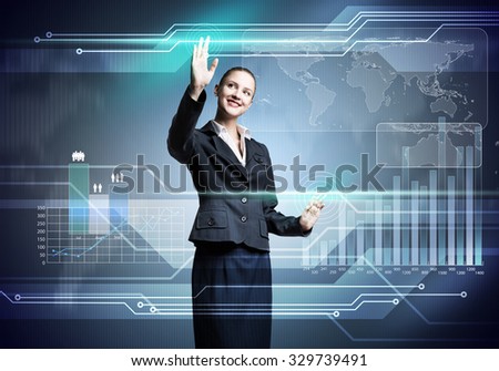 Pretty businesswoman working with virtual panel interface
