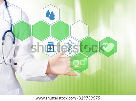 Close up of female doctor touching icon of media screen