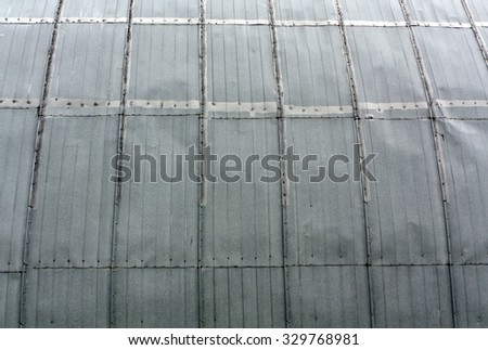 Metal hangar wall texture. Architectural background.
