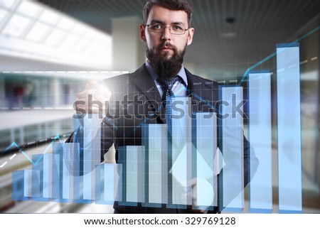 Businessman touching virtual screen with graph. Business, internet, technology concept.
