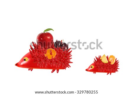 Healthy eating. Mother hedgehog with baby made ?? made from fruit and vegetables