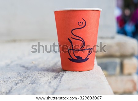 bright paper cup of coffee