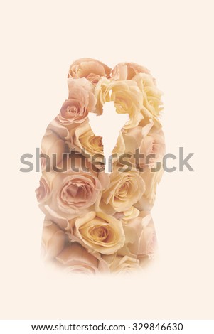 Double exposure portrait of a wedding couple combined with roses from the wedding bouquet