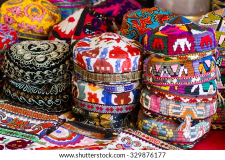 The traditional Uzbek cap, named tubeteika, duppi or kalpoq, decorated with multi colored embroidery. Bukhara, Uzbekistan, Central Asia Royalty-Free Stock Photo #329876177
