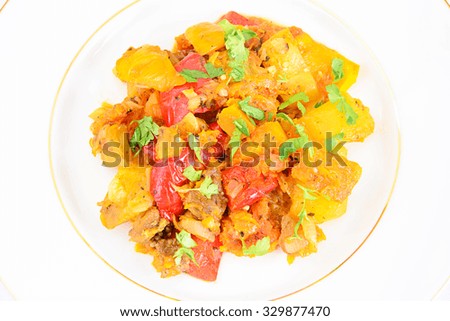 Healthy and Organic Food: Steamed Vegetables with Zucchini, Tomatoes, Onions, Carrots. Studio Photo