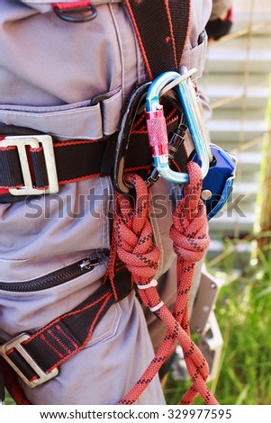 tower technician. carabiner. equipment for working at height with carabiner and rope