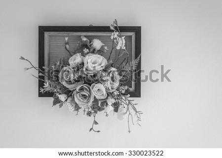 Fake flowers with white wall , black and white