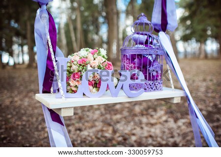 Wedding decoration of a beautiful delicate bouquet lying down on a swing