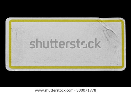 Blank Paper Tag or Label with Yellow Border isolated on Black Background. Sticker or Paper Adhesive with Wrinkles and Scratches. Close Up. Top View with Copy Space for Text or Image
