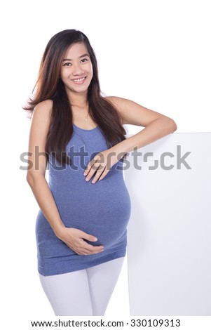 A portrait of Asian pregnant woman with a blank whiteboard, isolated