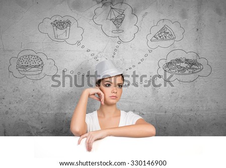 Portrait of pretty female holding blank white ad board and dreaming