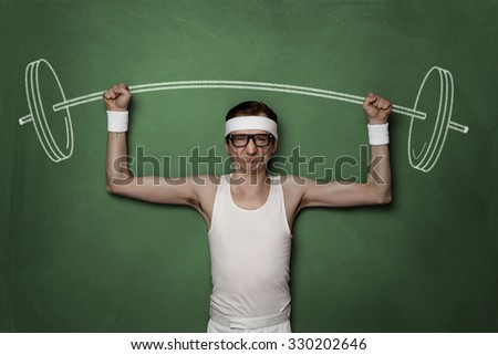 Funny retro sport nerd lifting weights drawn on a chalkboard Royalty-Free Stock Photo #330202646
