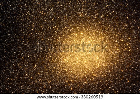 Abstract and Festive Background with Golden Glitter. Illuminated in the Corner.