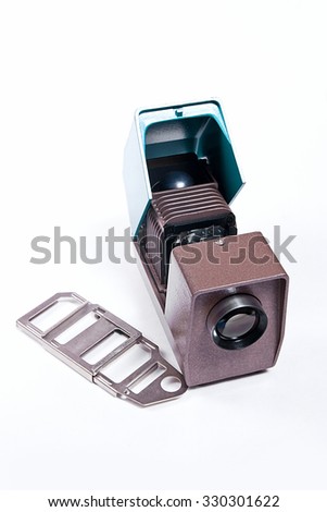 Vintage filmstrip projector on the white background. Old projector for displaying of slides.