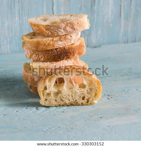 homemade rustic bread on a light wooden background