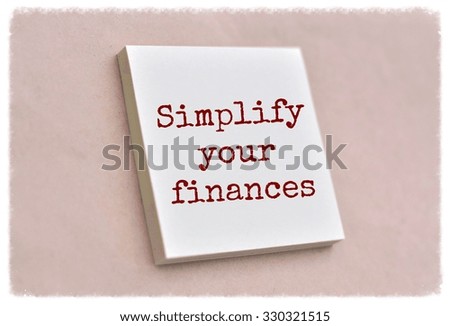 Text simplify your finances on the short note texture background