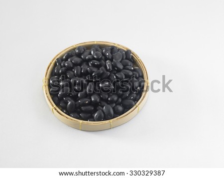 black bean in a white saucer