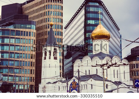The view of the church of St Nicholas and The White Square business centre in Moscow, Russia. Toned picture