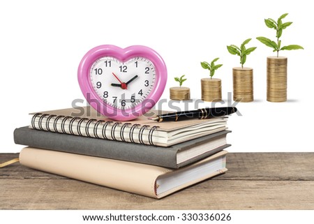 clock on book with money background