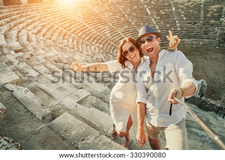 Happy young couple take self photo in Side amphitheater