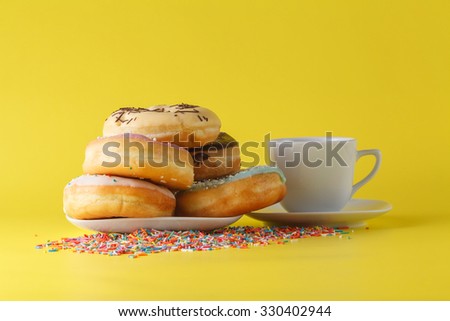 Fun donuts on bright yellow background