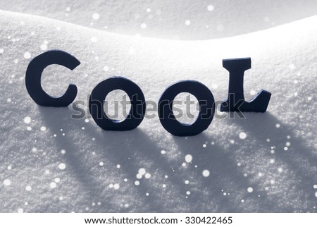 Blue Letters Building English Text Cool On White Snow. Snowy Landscape Or Scenery With Snowflakes. Christmas Card For Seasons Greetings Or Usable As Background.