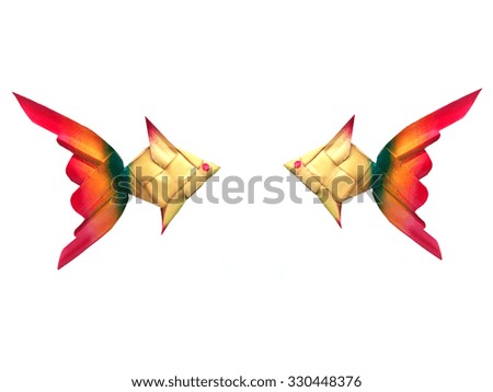 fish shaped ornaments made of palm leaf isolated on white background.