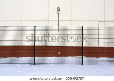 Color wall, fence and snow. Architectural bqackground.