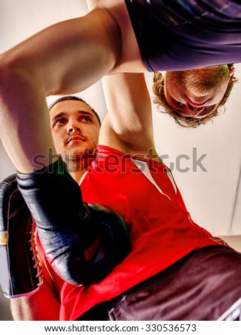Two  men boxer wearing  sport gloves boxing .Bottom view.