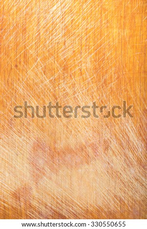 Old worn out cutting board with flour and dough residues. Background texture.