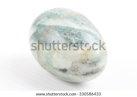 Egg made of stone isolated over the white background