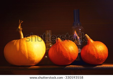 Autumn background. Pumpkins in a rural interior. Halloween.Photo toned in retro style.