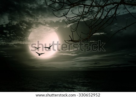 Halloween background, sea with branch and blurred full moon, Dark style.