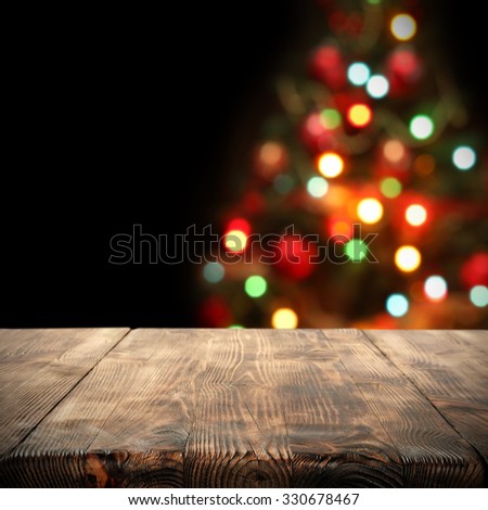black blurred background of christmas tree desk 