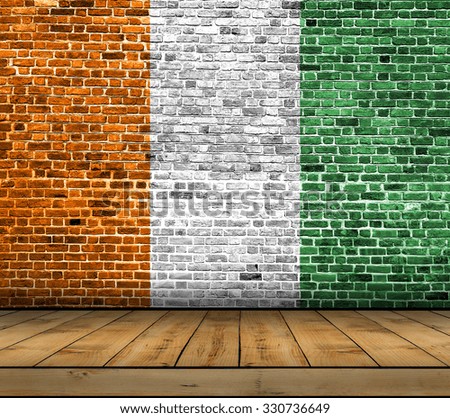 Cote D'lvoire flag painted on brick wall with wooden floor
