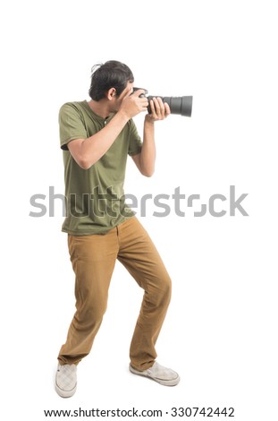 Asian of Happy Handsome young man photographer Smiling he's holding DSLR camera, shoot photo in studio isolated on white background