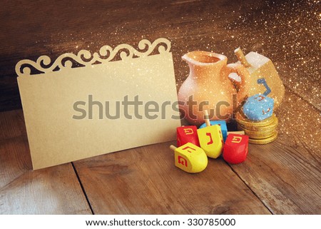 image of jewish holiday Hanukkah and wooden dreidels (spinning top) with empty card for adding text
