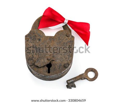 old rusty lock with a red bow isolated on white background