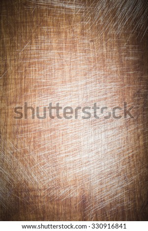 Old worn out cutting board with flour and dough residues. Background texture. Toned.