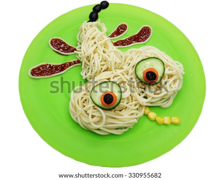 creative vegetable food meal with spaghetti dragon-fly form