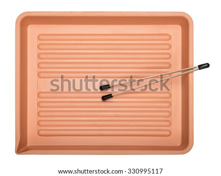 Developing tray and forceps, equipment for use with photo paper isolated on white background, top view