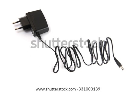 Black power ac to dc adapter in white background with full size cable and jack