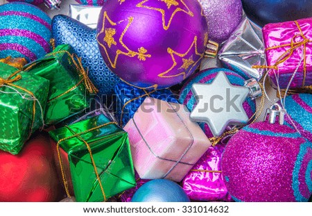 Christmas decorations and gift boxes on wooden board background