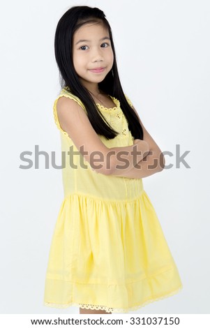 Portrait of Little asian girl with smiles face ,isolated on gray background

