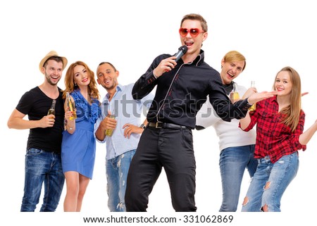 It's party time! Group of happy smiling friends with bottles of beer having fun together. Isolated on white.