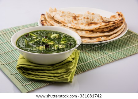 Palak paneer or Spinach and Cottage cheese curry is a healthy main course recipe in India, served with roti/chapati or naan, selective focus Royalty-Free Stock Photo #331081742