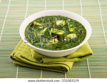 Palak paneer or Spinach and Cottage cheese curry is a healthy main course recipe in India, served in a bowl, isolated. selective focus Royalty-Free Stock Photo #331083119