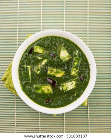 Palak paneer or Spinach and Cottage cheese curry is a healthy main course recipe in India, served in a bowl, isolated. selective focus Royalty-Free Stock Photo #331083137