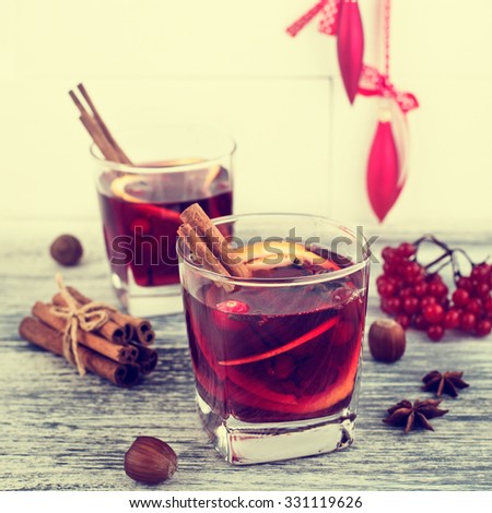 Mulled Wine and Spices on Wooden Rustic Background. Square Format. In Retro Tone Style.