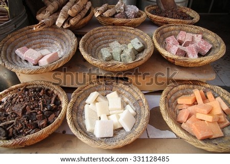 An array of products on display for sale at a Berber apothecary or pharmacy in the old town of Marrakesh, Morocco. Royalty-Free Stock Photo #331128485